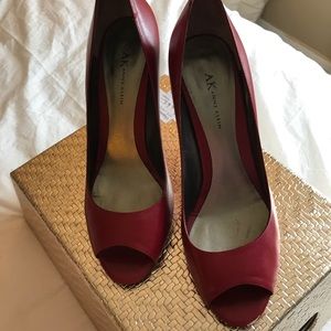 Red peep toe pumps